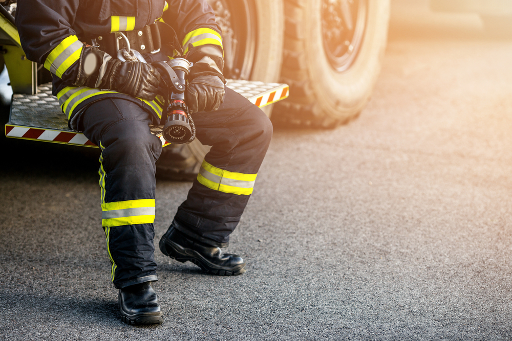 Wildland firefighter in uniform with boots